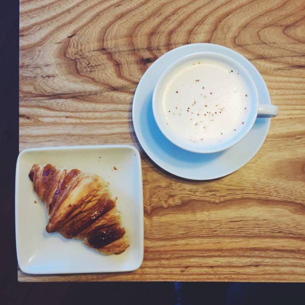 istock croissant and latte from above 936677592