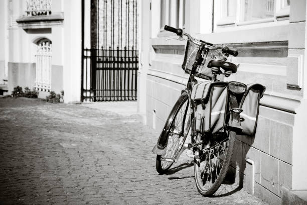 istock Old bycicle parked in the street 936681422