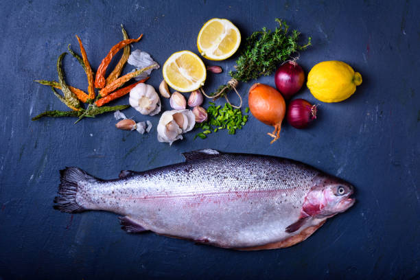 istock Fresh salmon with cooking ingredients. Raw fish 936681744