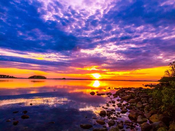 istock colorful sunset reflecting on a lake 936685492