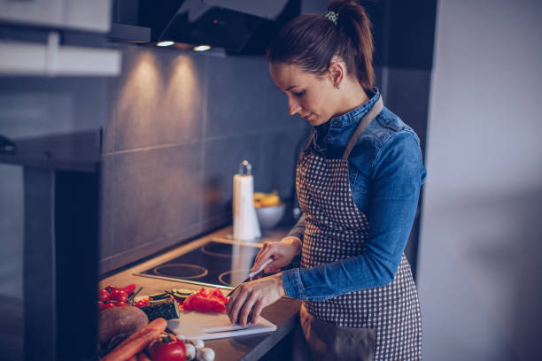 istock Pretty woman preparing food 936686100