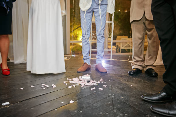 Groom breaking a glass at a Jewish wedding