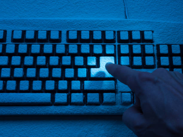 istock human forefinger pressing enter key on keyboard covered with snow illuminated with blue neon light 936693914