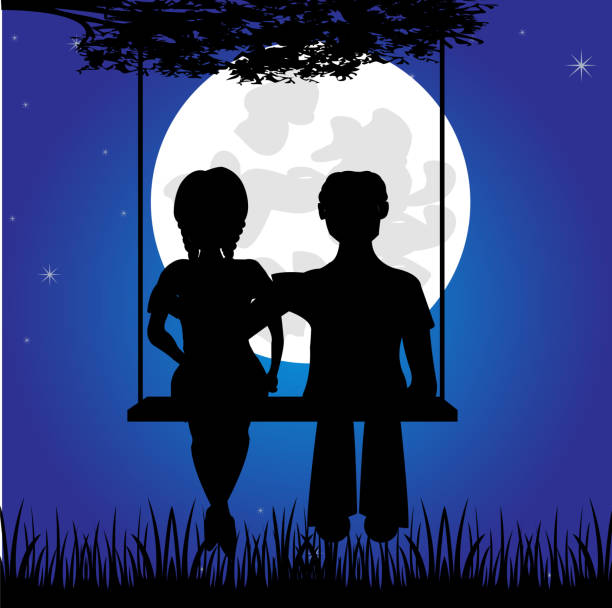 istock Girl and lad sit on seesaw 936694644