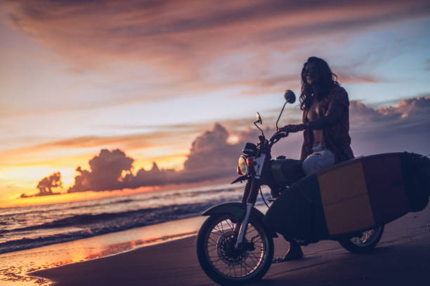 istock Surfer on a motorcycle at the beach 936697056