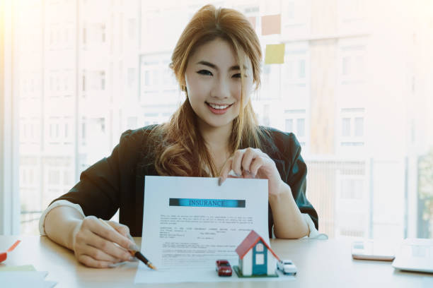Portrait of Attractive Asian real estate cheerful to sign home insurance - Business real estate concept Portrait of Attractive Asian real estate cheerful to sign home insurance - Business real estate concept documento stock pictures, royalty-free photos & images