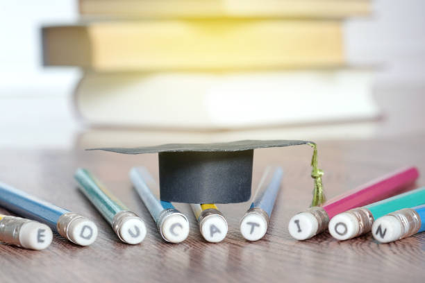 istock Pencil and Graduation hat ,Book background.Educational concept 936715022