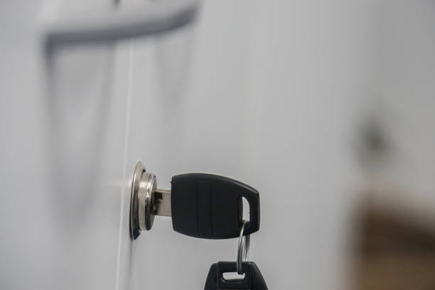 istock isolated close up drawer key in keyhole with reserved key 936716172