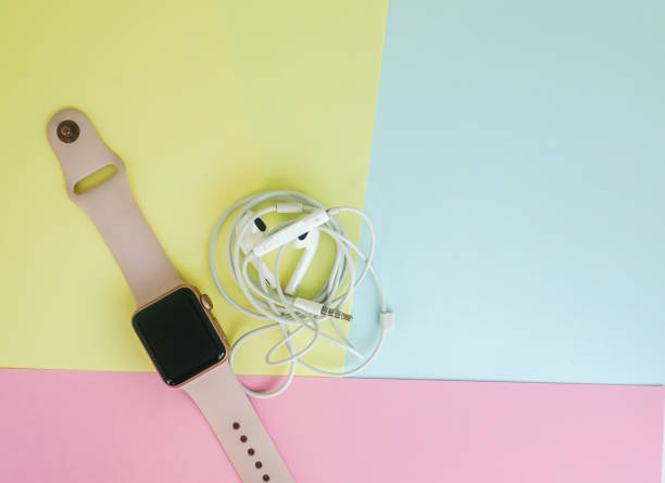 istock smart watch with headphones in pastel minimal background 936716186