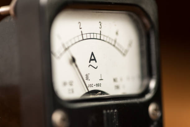 istock Closeup of an old black analog ampere meter 936716400