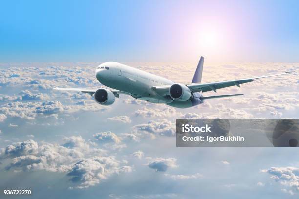 Passenger Airplane Flying Above Clouds View From The Window Plane To Amazing Sky At The Sunset Air Company Airline Stock Photo - Download Image Now