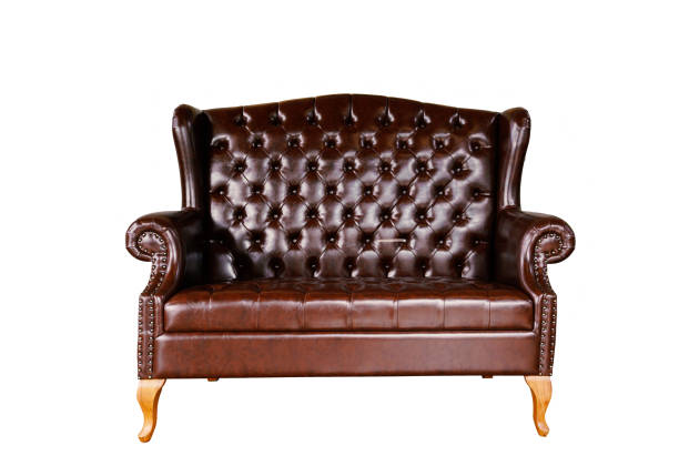 istock Vintage  brown leather sofa isolated on white background. 936722880