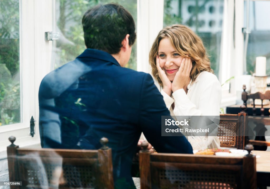 Business couple dating in the cafe Dating Stock Photo