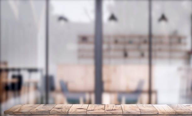 istock Wooden top table with white blurred cafe interior Background 936732190