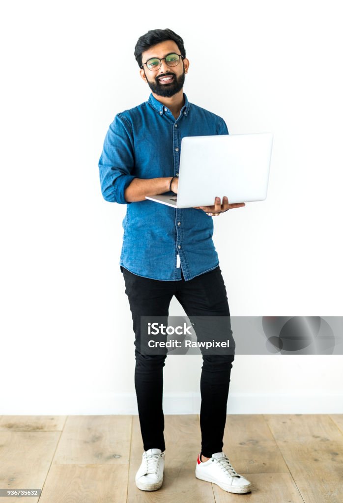 Man using laptop isolated on white background Men Stock Photo