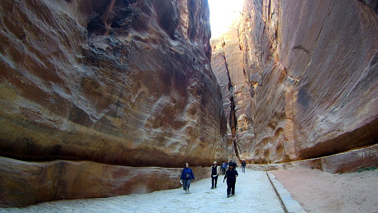 Petra. Jordan. - December. 10. 2017: tourists are viewing a canyon and an ancient city. Petra in Jordan
