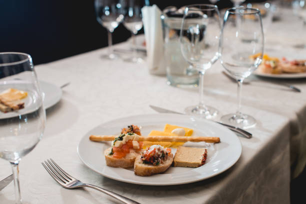 istock Table served for a wine tasting. Snacks with Pasta, Cheese, Vegetables. Spain tapas recipe food pintxos. Served dish for food and wine tasting 936742094