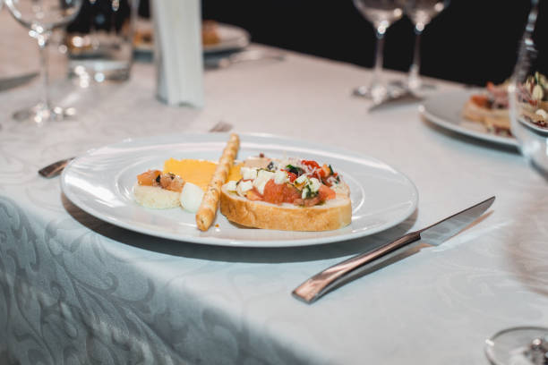 istock Table served for a wine tasting. Snacks with Pasta, Cheese, Vegetables. Spain tapas recipe food pintxos. Served dish for food and wine tasting 936742278