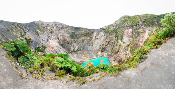 Volcan Irazu and its Large Green Lagoon in Costa Rica A green lagoon sits inside the crater of Volcan Irazu in central Costa Rica. irazu stock pictures, royalty-free photos & images