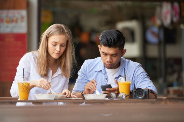 istock Couple eating street food 936758024