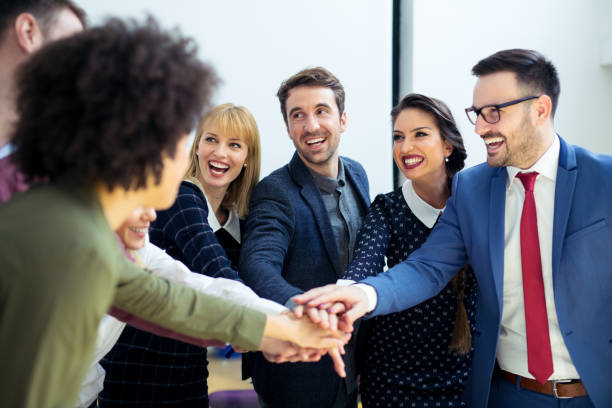 istock Business team joining hands together 936758042