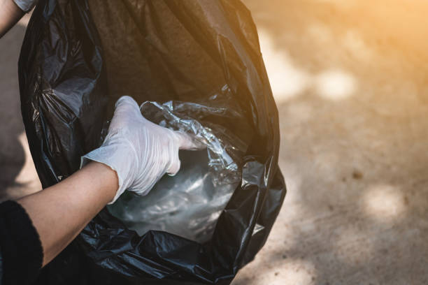 istock Women volunteer help garbage collection charity environment. 936762340