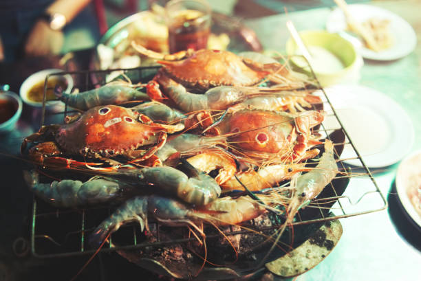 istock Seafood buffet concept. shrimp and crab grilled on stove, soft focus. 936762822