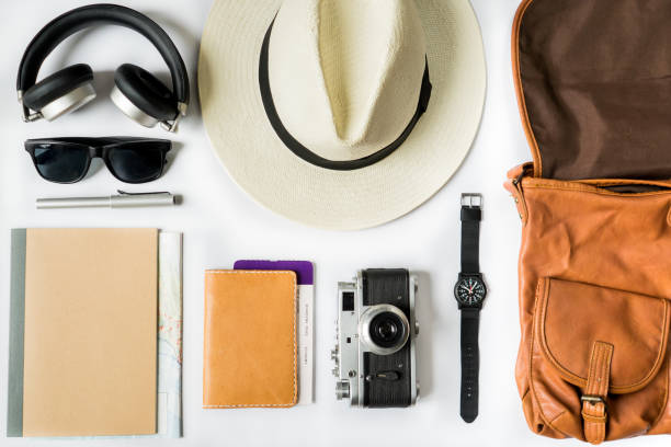 istock Top view of travel accessories on white table 936765620
