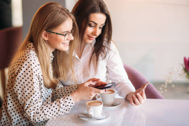 istock girls use their break from work to drink coffee and chat 936766138