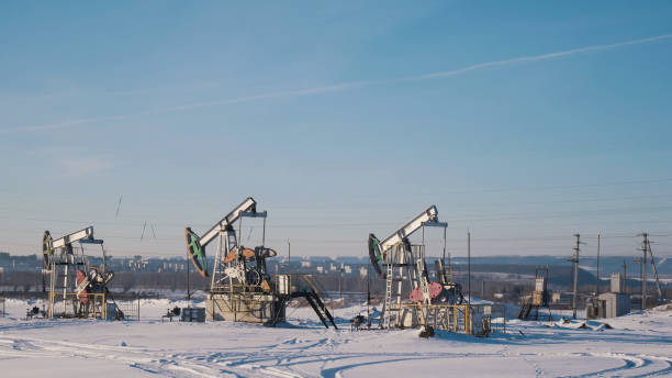 istock Working oil pumps in the winter field 936770794