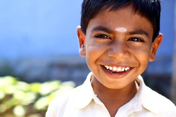 Cheerful funny little boy portrait looking at the camera.
