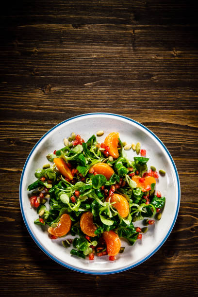 istock Vegetable salad on wooden background 936773164