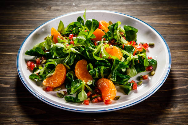 istock Vegetable salad on wooden background 936773176