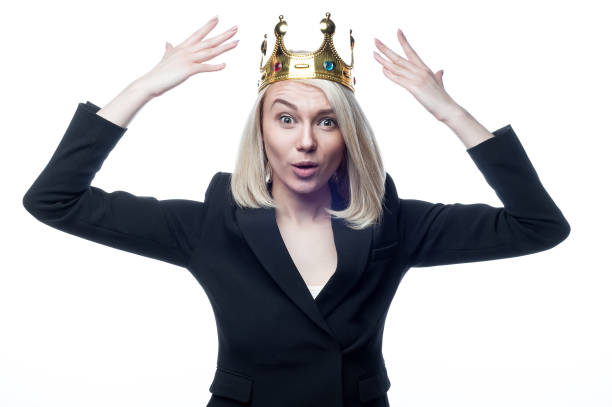 istock Blond girl with crown on head on white background 936773504