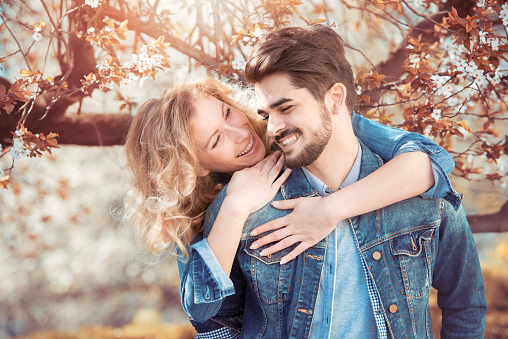 Young couple in love outdoor.Loving couple smiling and enjoying outdoors.