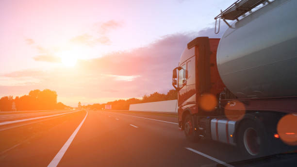 istock Cargo container tank truck highway road rural countryside sunset 936773980