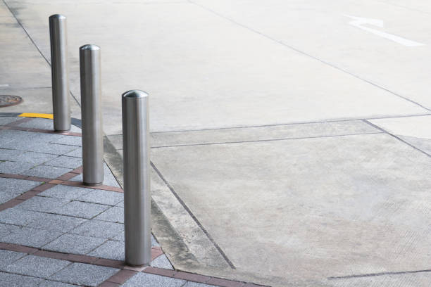 istock stainless steel bollards on foot path 936776644