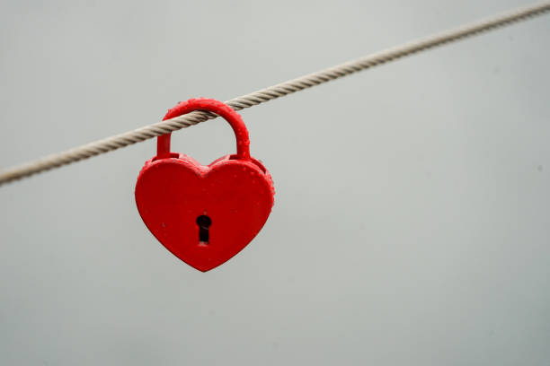 istock Colored locks hanging on the bridge for love 936781438