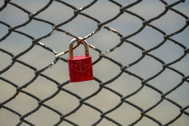 istock Colored locks hanging on the bridge for love 936781494