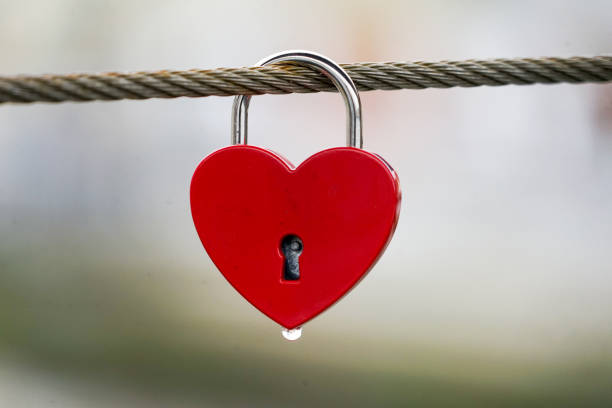 istock Colored locks hanging on the bridge for love 936781592