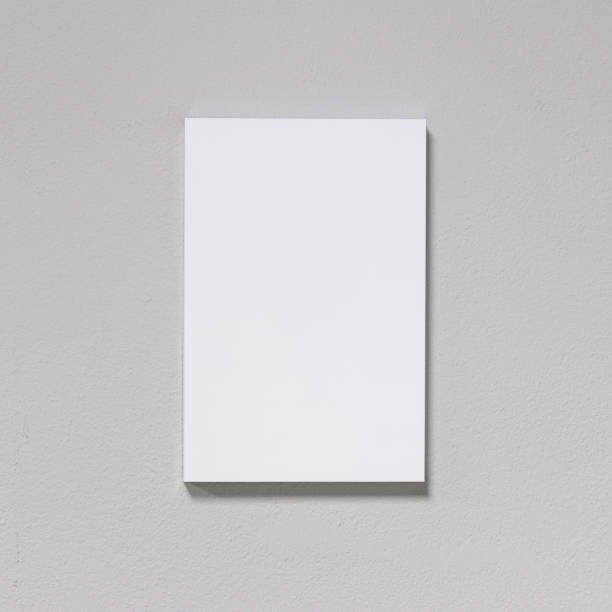 istock White picture frame on cement wall. Modern gallery in simple style. 936782124