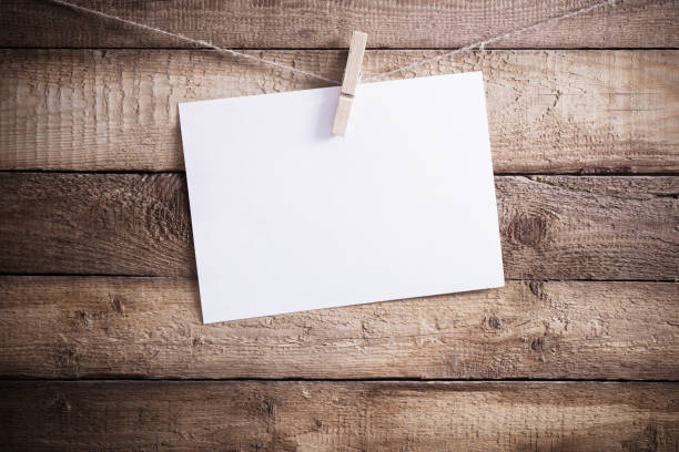 istock the paper on old wooden background 936786310