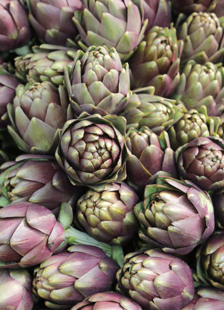 background of many ripe artichokes for sale