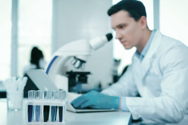 istock Focused photo on test tubes that standing on the support 936792924