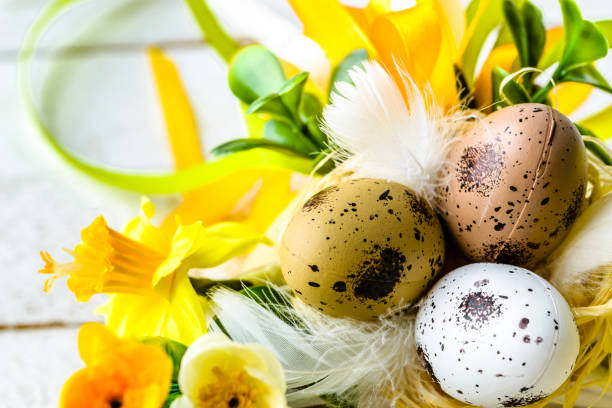 istock Easter background with spring easter eggs and flowers on wooden table 936793556
