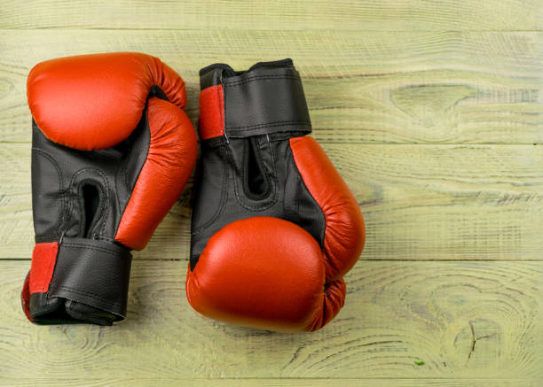 istock boxing gloves on a wooden background. 936793578