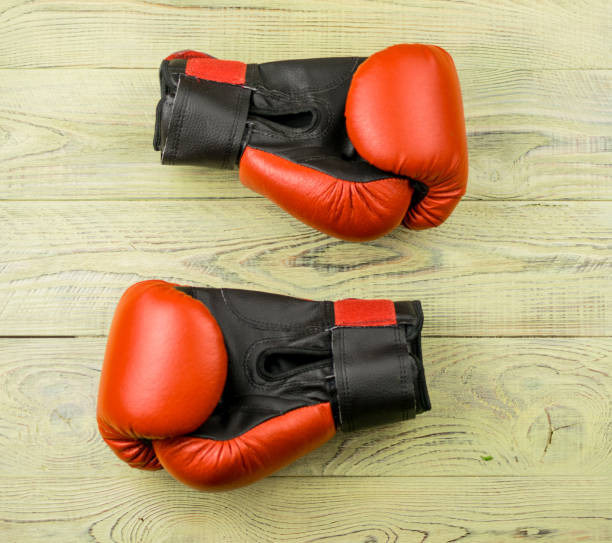 istock boxing gloves on a wooden background. 936793696