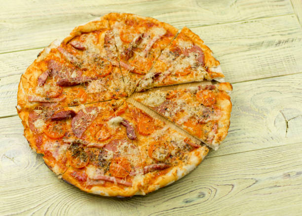 istock Freshly prepared homemade pizza on a wooden background. 936793804