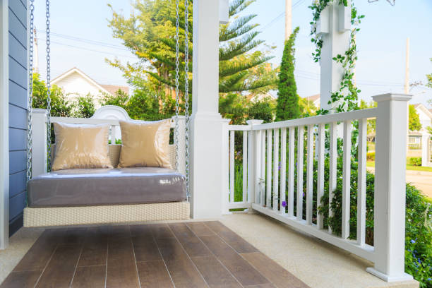 istock A modern swing at a balcony with nature background. 936799232