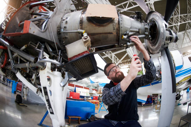 istock Aircraft mechanic in the hangar 936801624